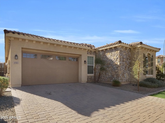 mediterranean / spanish house featuring a garage