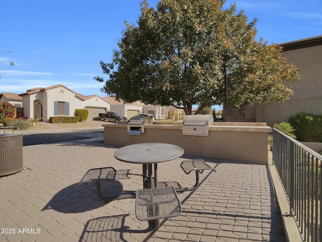 view of patio / terrace featuring area for grilling and a grill