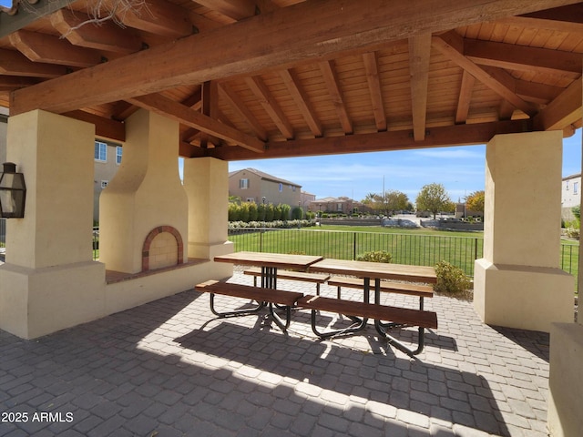 view of patio / terrace with exterior fireplace