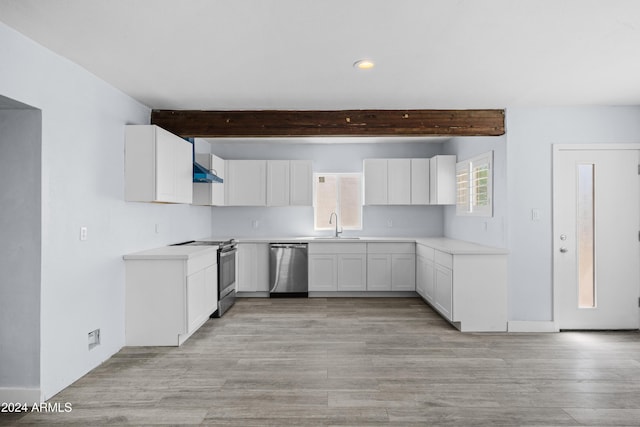 kitchen with light wood-type flooring, range hood, appliances with stainless steel finishes, beamed ceiling, and white cabinetry