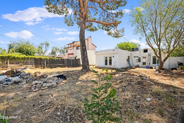 view of yard with french doors