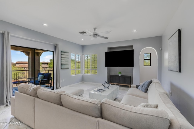 3935 E Rough Rider Rd Unit 1039, Phoenix, AZ 85050 - living area with a ceiling fan, baseboards, recessed lighting, light tile patterned floors, and arched walkways
