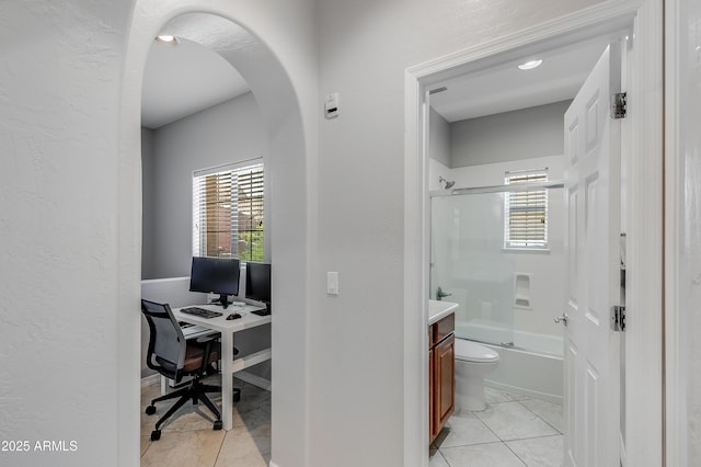 3935 E Rough Rider Rd Unit 1039, Phoenix, AZ 85050 - office area featuring light tile patterned floors, arched walkways, and a textured wall
