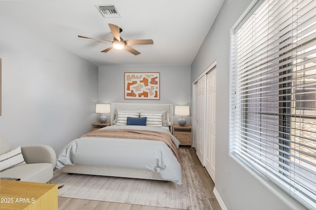 3935 E Rough Rider Rd Unit 1039, Phoenix, AZ 85050 - bedroom featuring wood finished floors, a closet, and ceiling fan