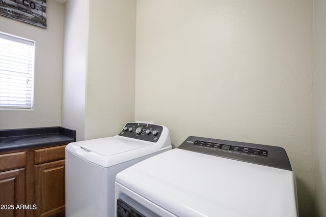 3935 E Rough Rider Rd Unit 1039, Phoenix, AZ 85050 - laundry area with washing machine and dryer and cabinet space