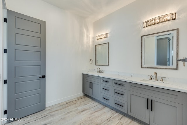 bathroom featuring hardwood / wood-style floors and vanity