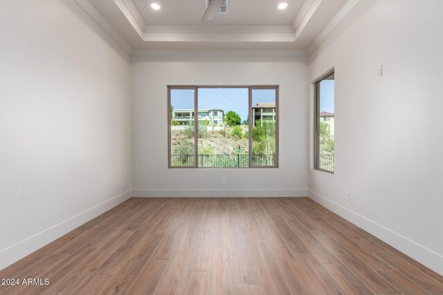 15522 E Chicory Dr, Fountain Hills, AZ 85268 - unfurnished room featuring a raised ceiling, light wood-style floors, crown molding, baseboards, and recessed lighting