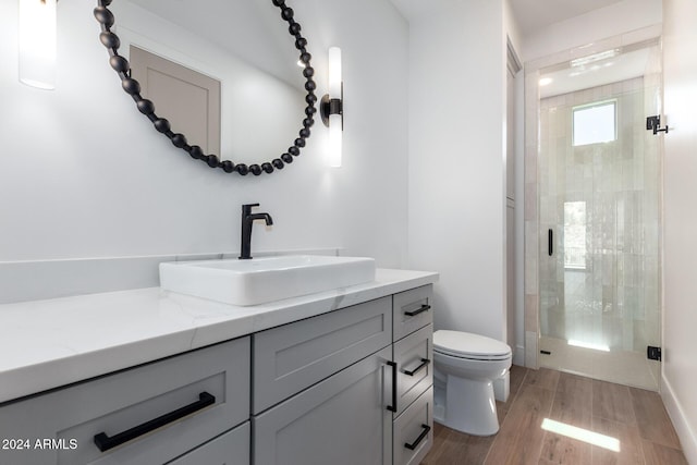 15522 E Chicory Dr, Fountain Hills, AZ 85268 - bathroom featuring toilet, a shower stall, wood finished floors, and vanity