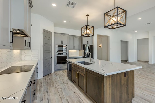 15522 E Chicory Dr, Fountain Hills, AZ 85268 - kitchen featuring appliances with stainless steel finishes, a sink, light wood-style flooring, tasteful backsplash, and recessed lighting