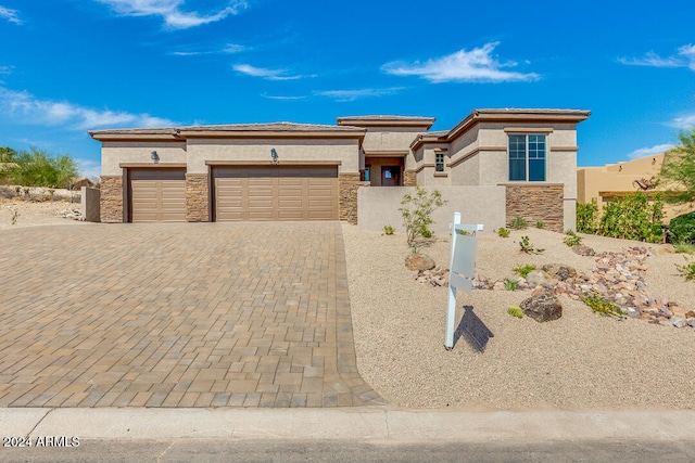 prairie-style house featuring a garage