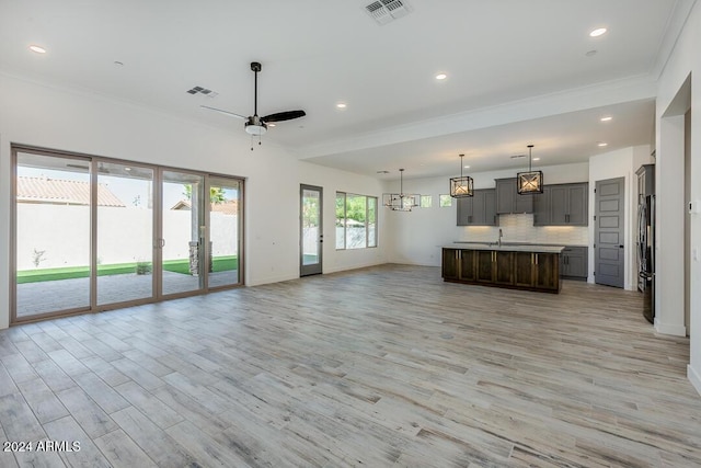 15522 E Chicory Dr, Fountain Hills, AZ 85268 - unfurnished living room with crown molding, light wood finished floors, baseboards, recessed lighting, and a ceiling fan