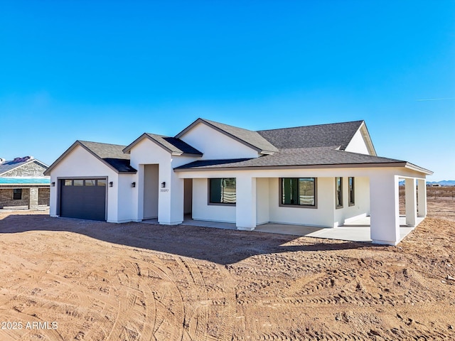 view of front of property featuring a garage