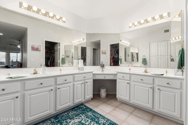 bathroom with vanity, lofted ceiling, tile patterned floors, and ceiling fan