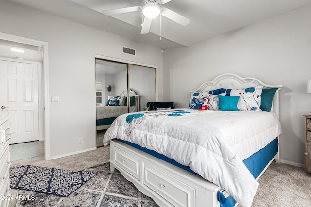 bedroom with carpet flooring, ceiling fan, and a closet