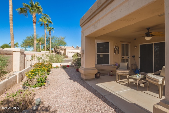 view of patio featuring ceiling fan