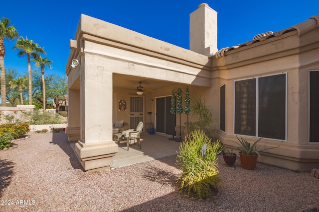 back of house featuring a patio area and ceiling fan