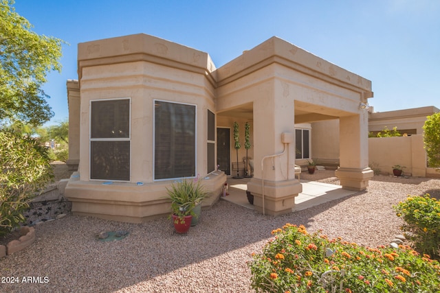 rear view of house with a patio