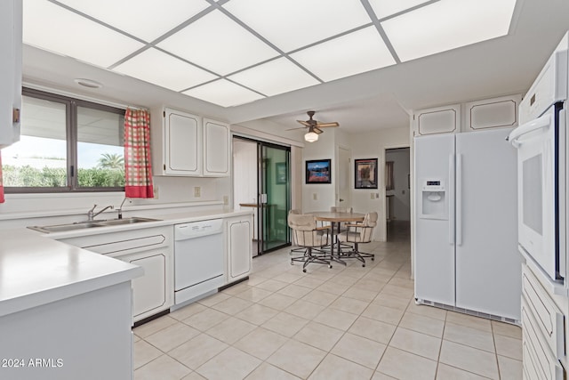 kitchen with white cabinets, ceiling fan, white appliances, and sink