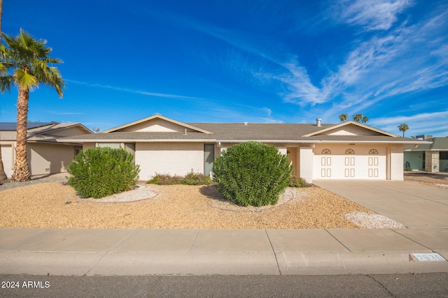 ranch-style home featuring a garage