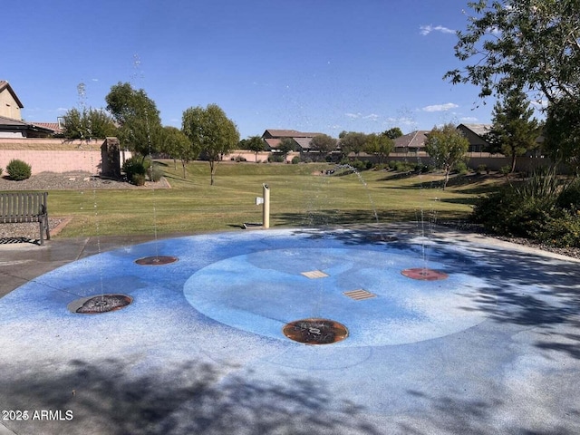 view of property's community featuring a lawn