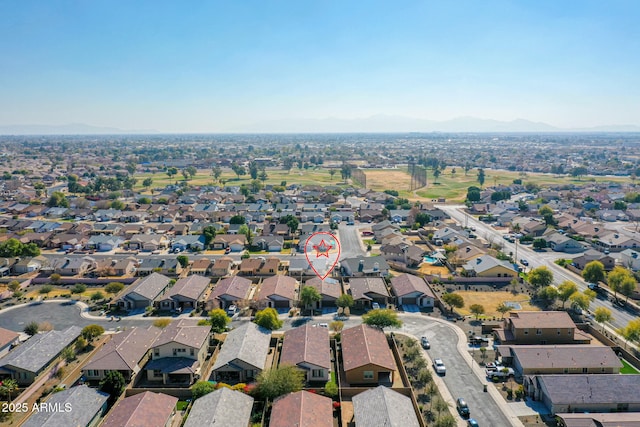 birds eye view of property featuring a mountain view