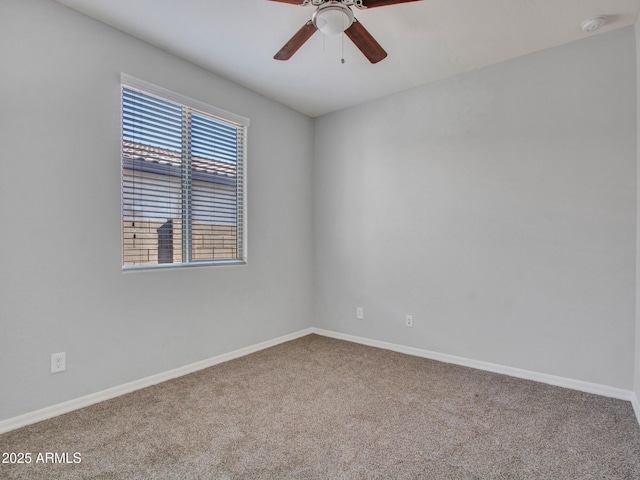 spare room featuring carpet flooring and ceiling fan