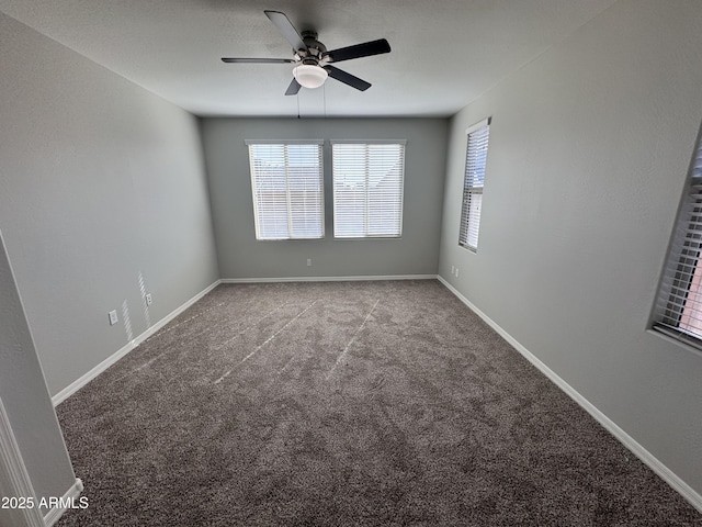 unfurnished room with ceiling fan and light carpet