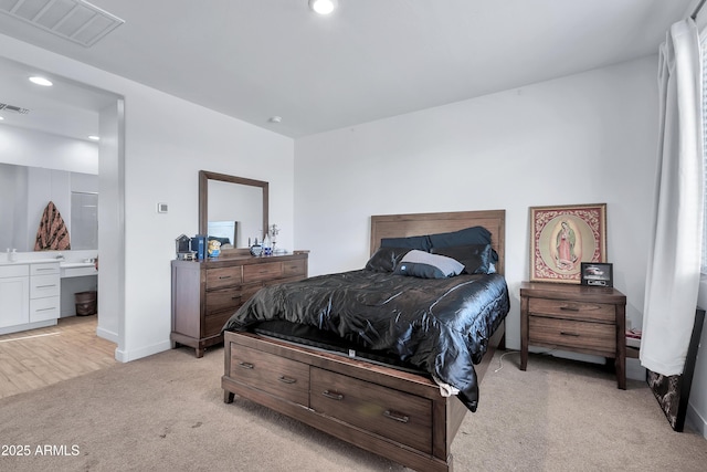 bedroom featuring light colored carpet