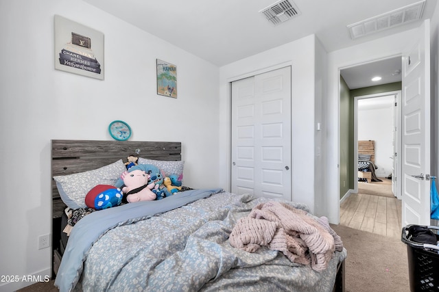 carpeted bedroom with a closet