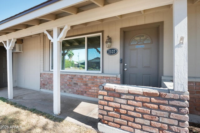 doorway to property featuring covered porch