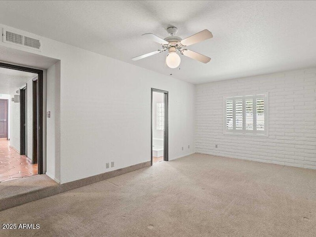7232 N 22 Nd St, Phoenix, AZ 85020 - unfurnished room with brick wall, light colored carpet, a ceiling fan, and baseboards