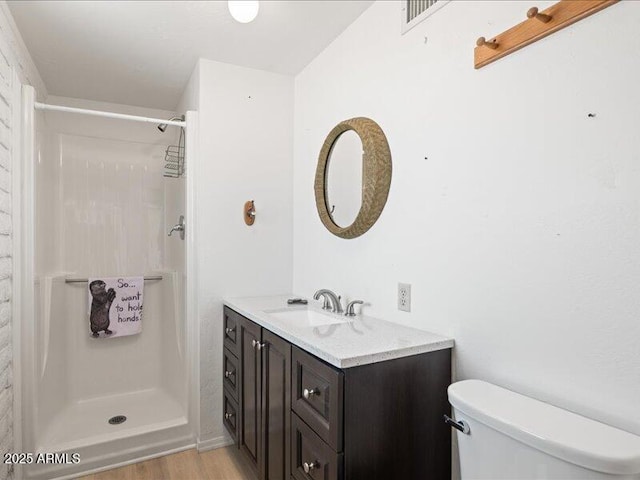 7232 N 22 Nd St, Phoenix, AZ 85020 - full bathroom with toilet, vanity, a stall shower, and wood finished floors