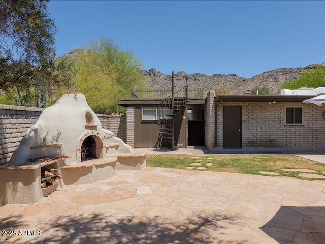 7232 N 22 Nd St, Phoenix, AZ 85020 - view of patio featuring exterior fireplace and a mountain view