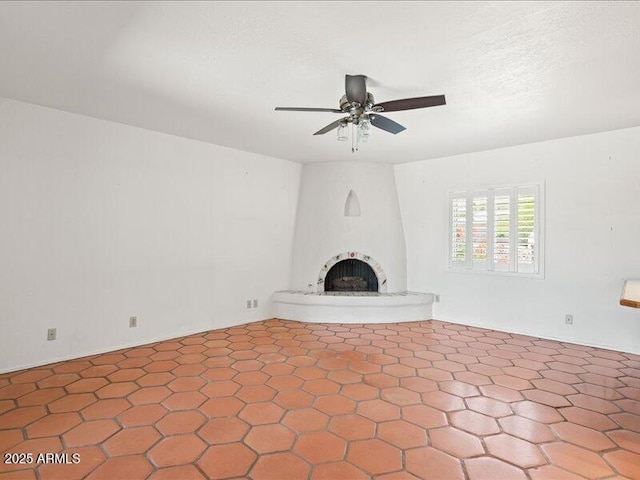 7232 N 22 Nd St, Phoenix, AZ 85020 - unfurnished living room featuring a large fireplace and ceiling fan