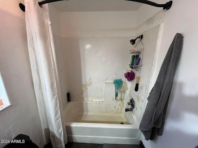 bathroom with shower / bath combination with curtain