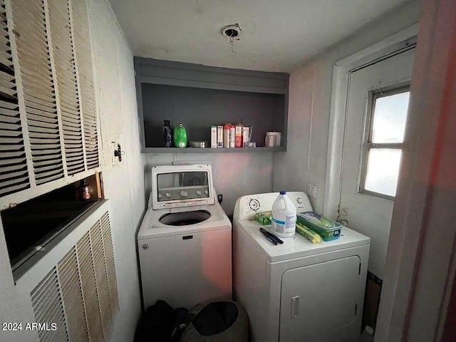 laundry room featuring washing machine and dryer