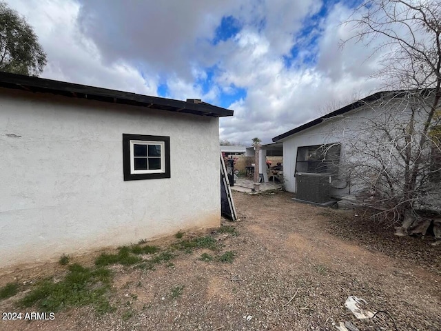 view of property exterior featuring central AC