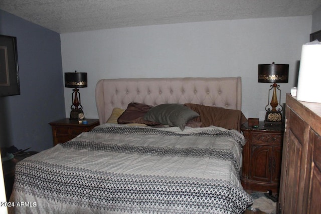 bedroom featuring a textured ceiling