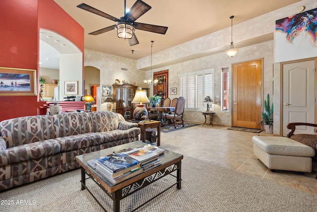 32826 N 54th St, Cave Creek, AZ 85331 - living area with a ceiling fan, a chandelier, light tile patterned floors, and arched walkways