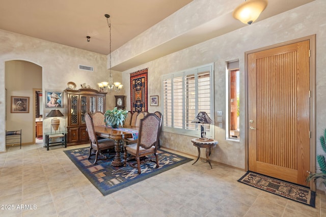 32826 N 54th St, Cave Creek, AZ 85331 - tiled dining room with arched walkways and a chandelier