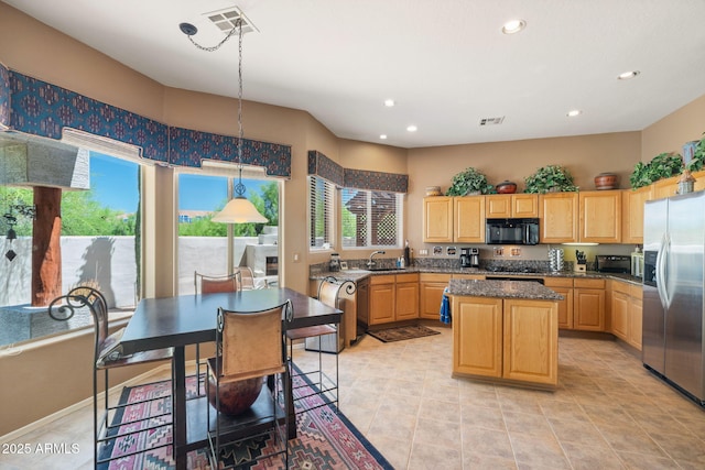 32826 N 54th St, Cave Creek, AZ 85331 - kitchen featuring black microwave, stainless steel fridge, plenty of natural light, light brown cabinets, and recessed lighting