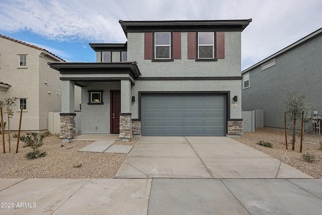 view of front of house featuring concrete driveway, stucco siding, stone siding, and a garage