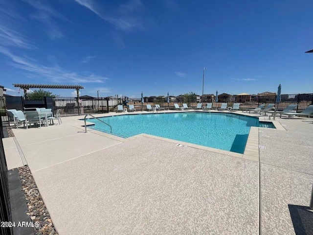 pool featuring a patio and fence