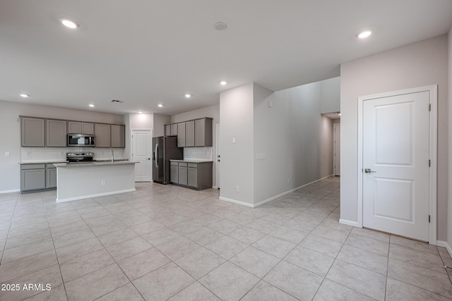 unfurnished living room with light tile patterned floors