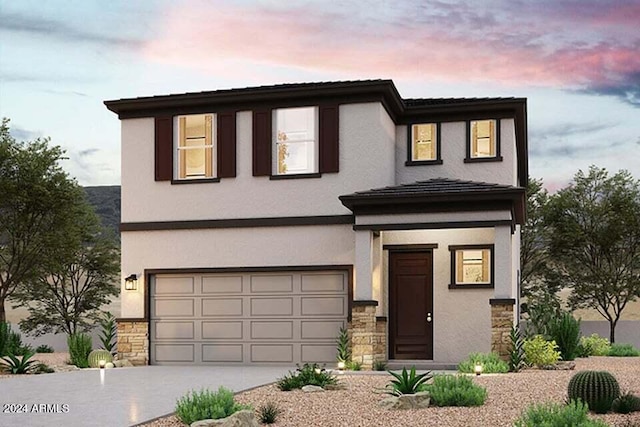 view of front of home with a garage, stucco siding, stone siding, and concrete driveway