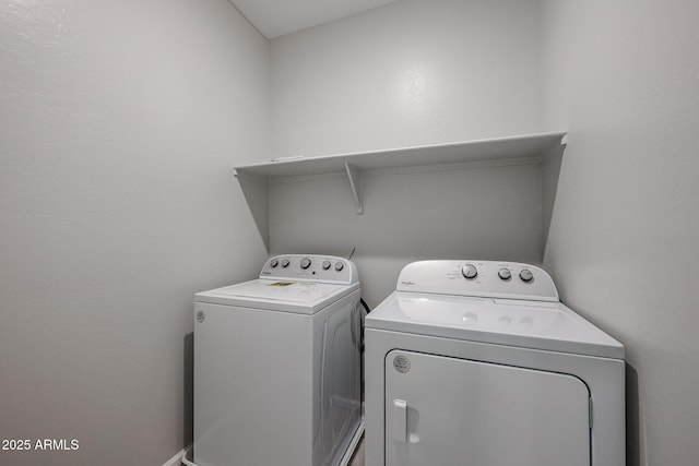 clothes washing area featuring separate washer and dryer