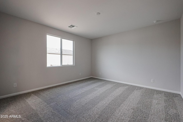 empty room with carpet flooring