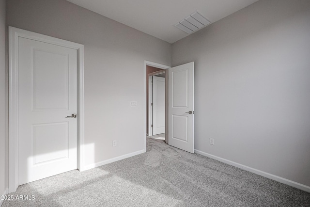 unfurnished bedroom featuring light colored carpet