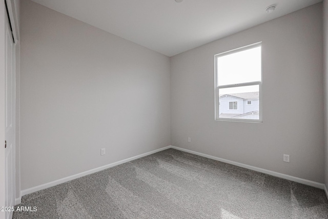 unfurnished room featuring carpet