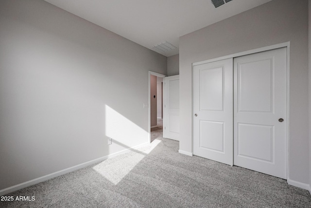 unfurnished bedroom featuring a closet and carpet